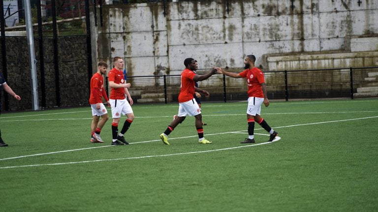Players celebrating after goal
